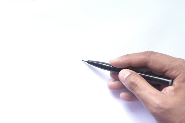 Close up of man hand writing on a white paper