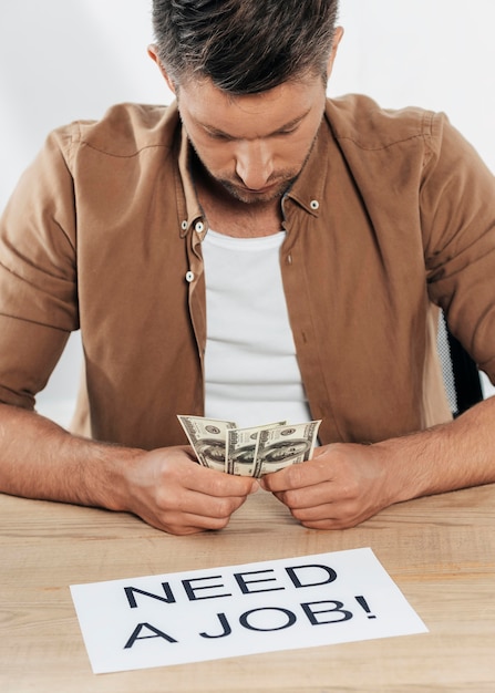 Close-up man holding banknotes