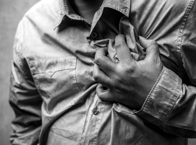 close-up of man holding chest