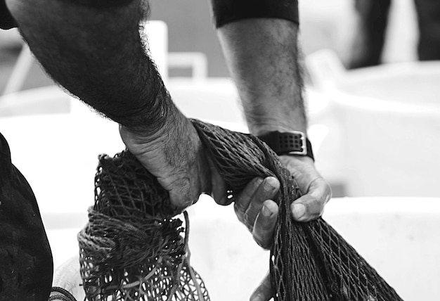 Photo close-up of man holding fishing net