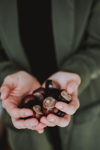 Close-up of man holding fruit