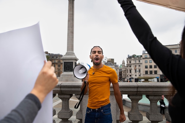 Photo close up man holding megaphone