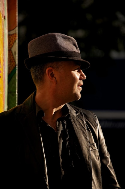 close-up of man looking away in city