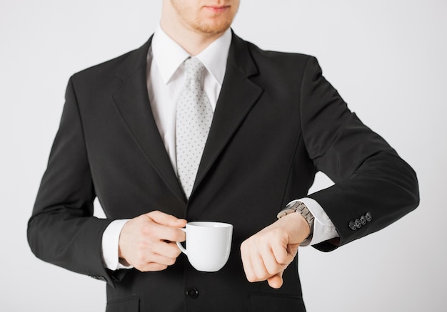 close up of man looking at wristwatch