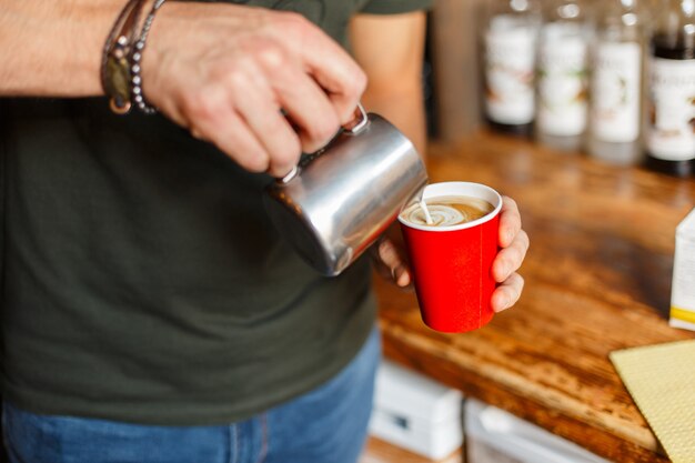 Close up on man making coffee