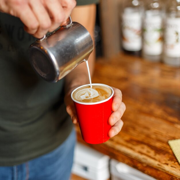 Close up on man making coffee