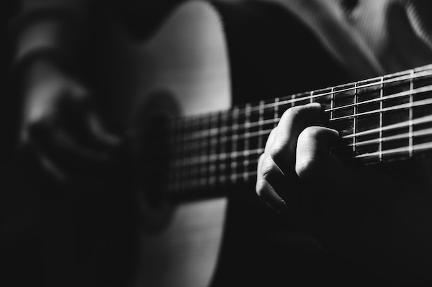 Photo close-up of man playing guitar