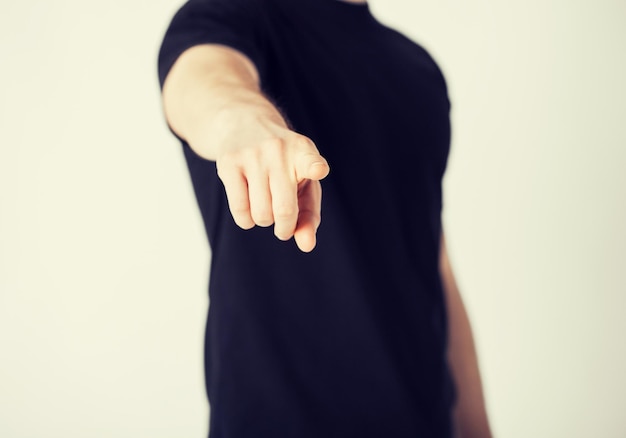 close up of man pointing his finger at you