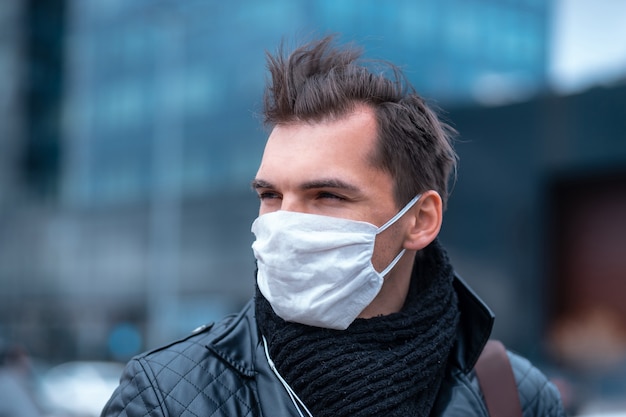 Close up. man in the protective mask is looking confidently ahead.