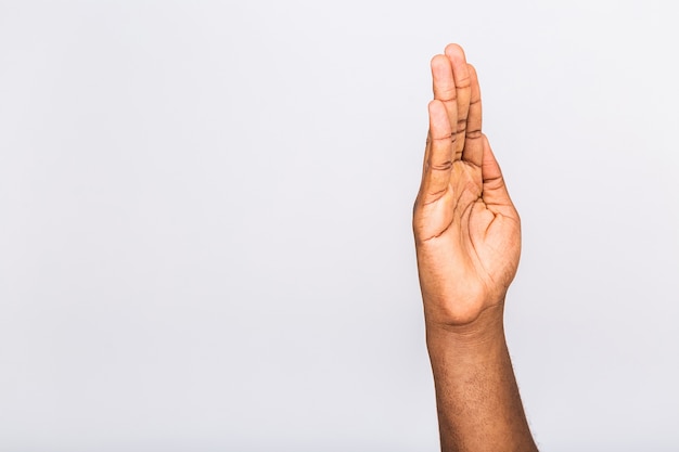 Close up of man's hand showing gesture raising hands up