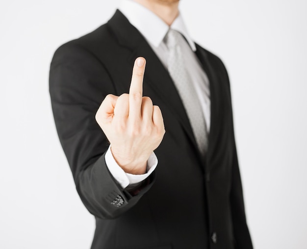 close up of man showing middle finger