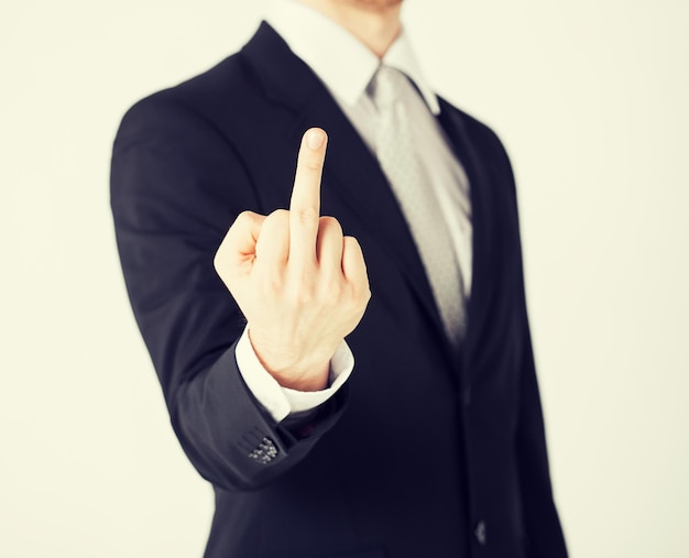 close up of man showing middle finger