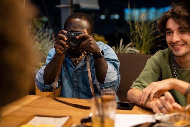 Photo close up man taking photos with camera