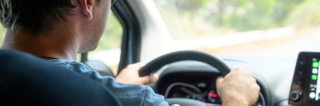 Close up on man taking a test car drive