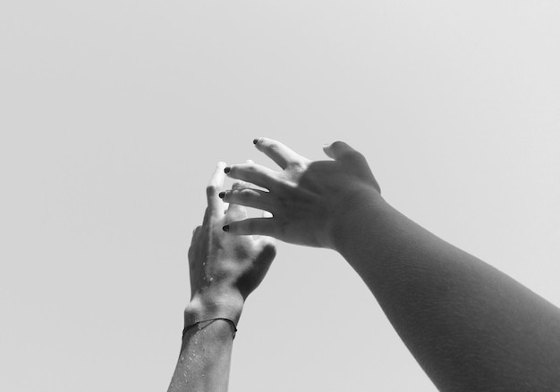 Photo close-up of man touching against white background