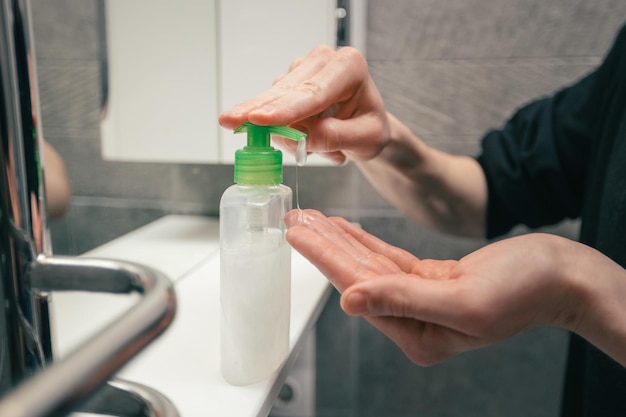 Close up. man using bactericidal hand soap. concept of prevention of infectious diseases.