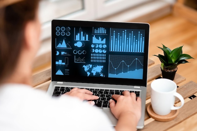 Close-up of man using laptop on table