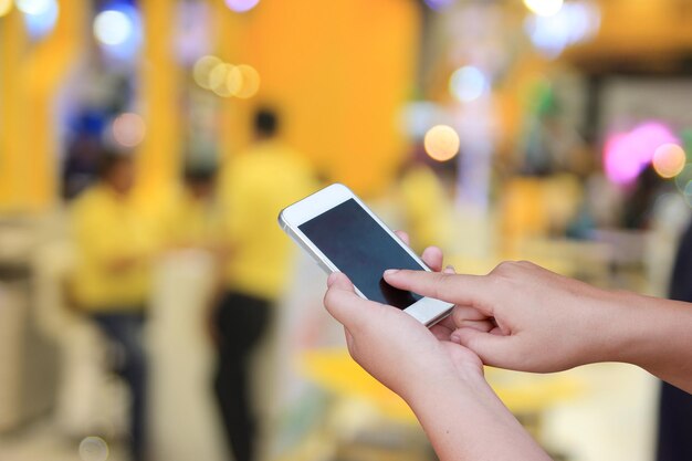 Close-up of man using mobile phone