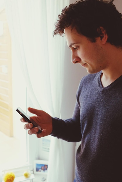 Close-up of man using mobile phone