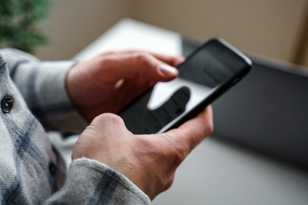 Close-up of a man using a mobile phone