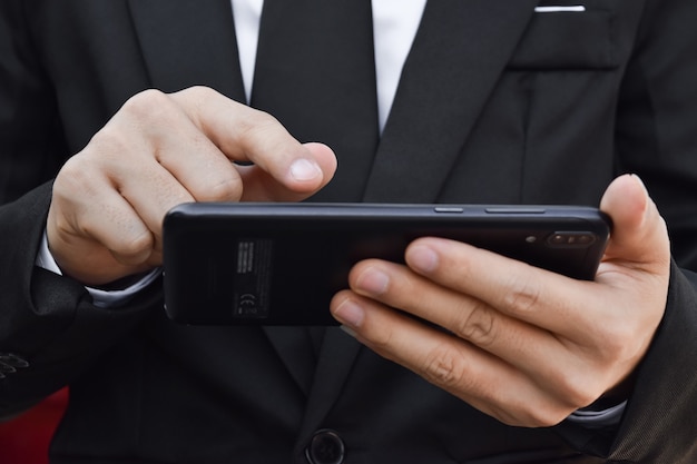 Close up of man using mobile smartphone