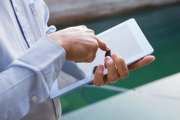 Close up of man using tablet