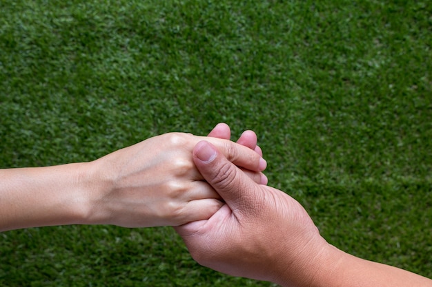 Close up on a man and a woman holding hands