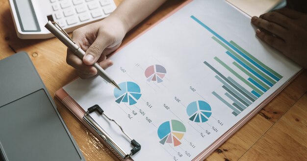 Close up a man working about financial with calculator at his office to calculate expenses, Accounting concept