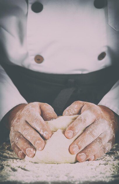 Close-up of man working on cutting board