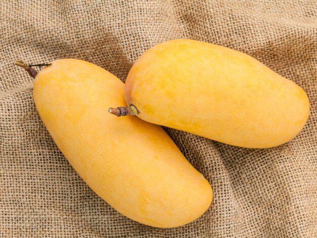 Close-up of mangoes on sack