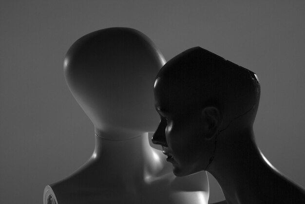 Close-up of mannequins against gray background