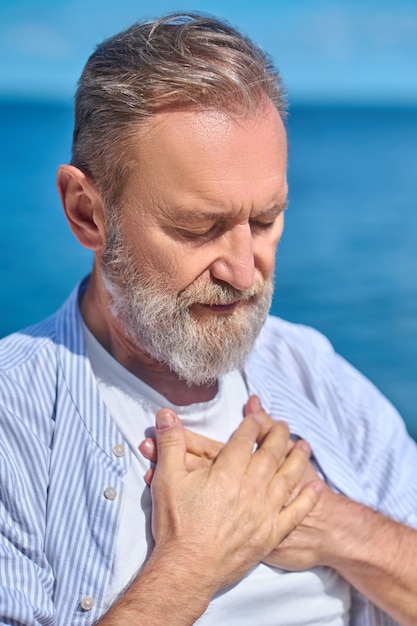 Close up of a mans face with closed eyes