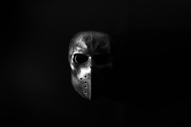 Photo close-up of mask against black background