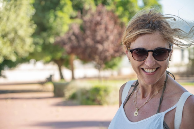 Close up of a mature young woman with sunglasses