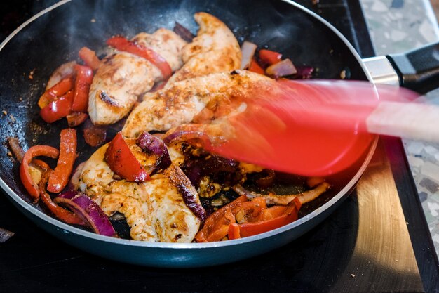 Close-up of meal being prepared in pan