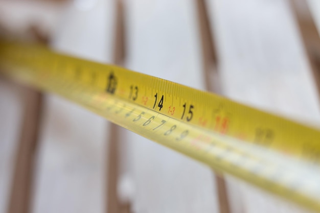 Photo close-up of measuring tape on table