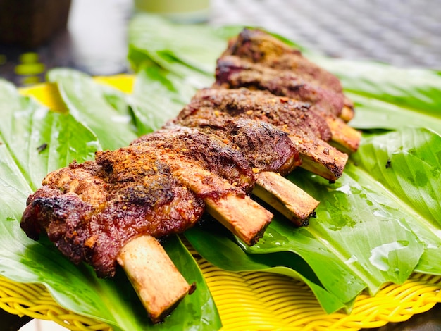 Photo close-up of meat on barbecue grill