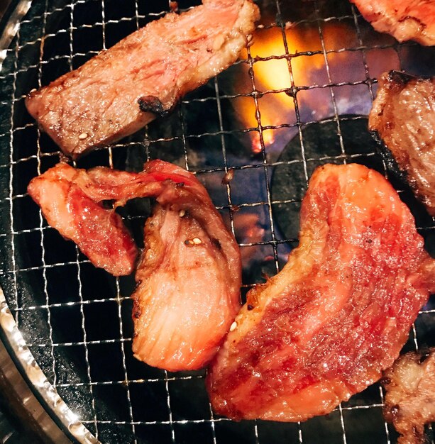 Close-up of meat on barbecue grill