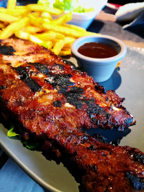 Close-up of meat on barbecue grill