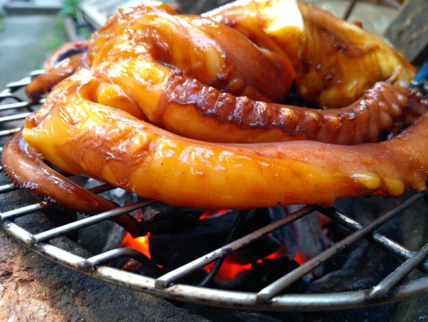 Close-up of meat on barbecue grill