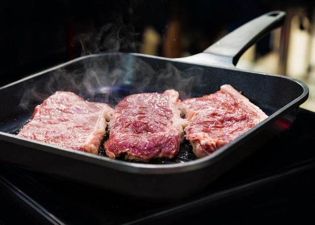 Close-up of meat in cooking pan