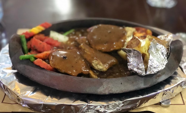 Close-up of meat in plate on table