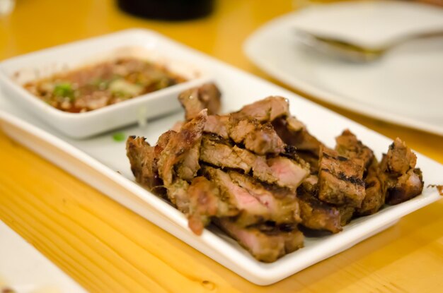 Close-up of meat in plate on table