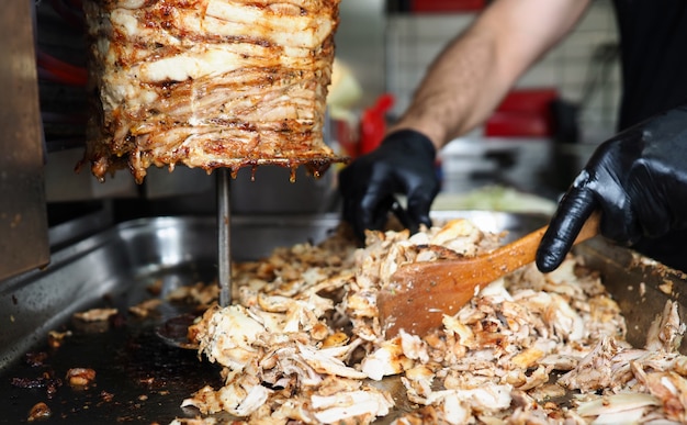 Close-up meat on special equipment, cook shawarma