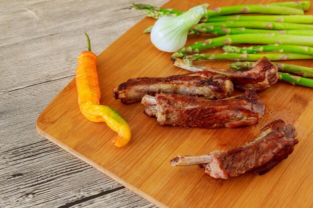 Close-up of meat with vegetables and spice on table