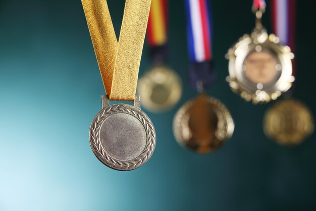 Close-up of medals against blackboard