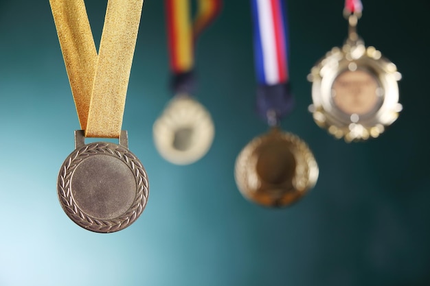 Photo close-up of medals against blackboard