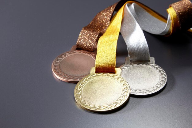 Close-up of medals against gray background