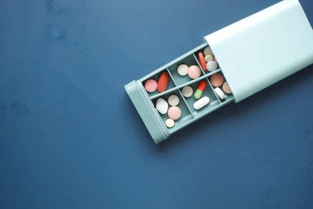 Close up of medical pills in a pill box on table