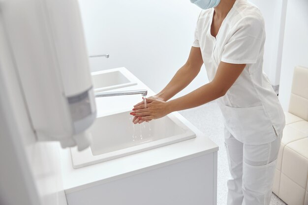 Close Up Of Medical Staff Washing HandsDisinfect their Hands Before Surgery